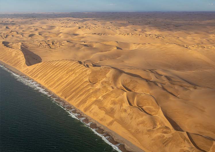 Atlantic ocean and dunes in Namibia
